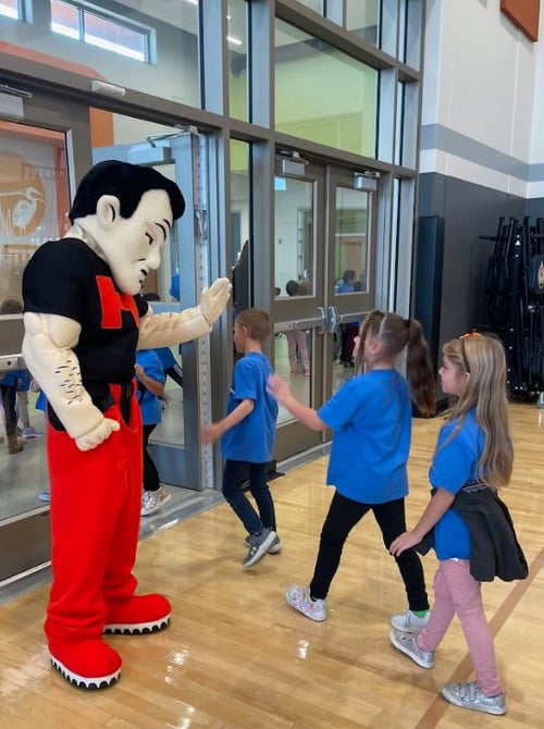 Marshmen Mascot Greeting Students